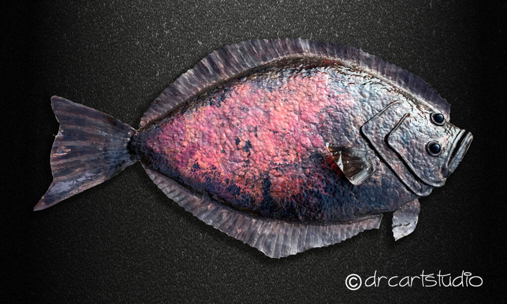 A photo of a hand made copper fish, a flounder