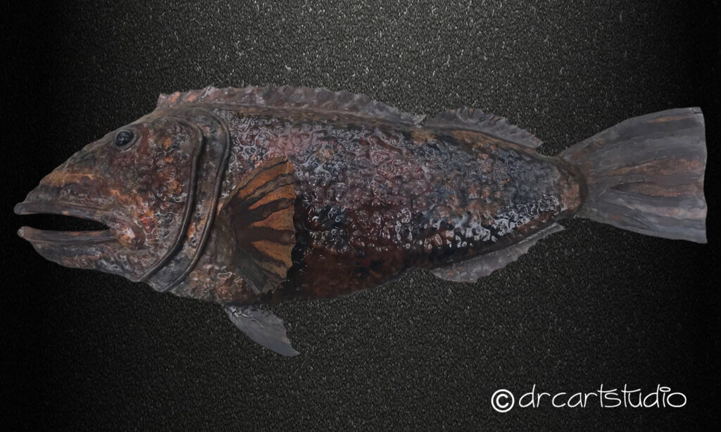 A photo of a hand made copper fish