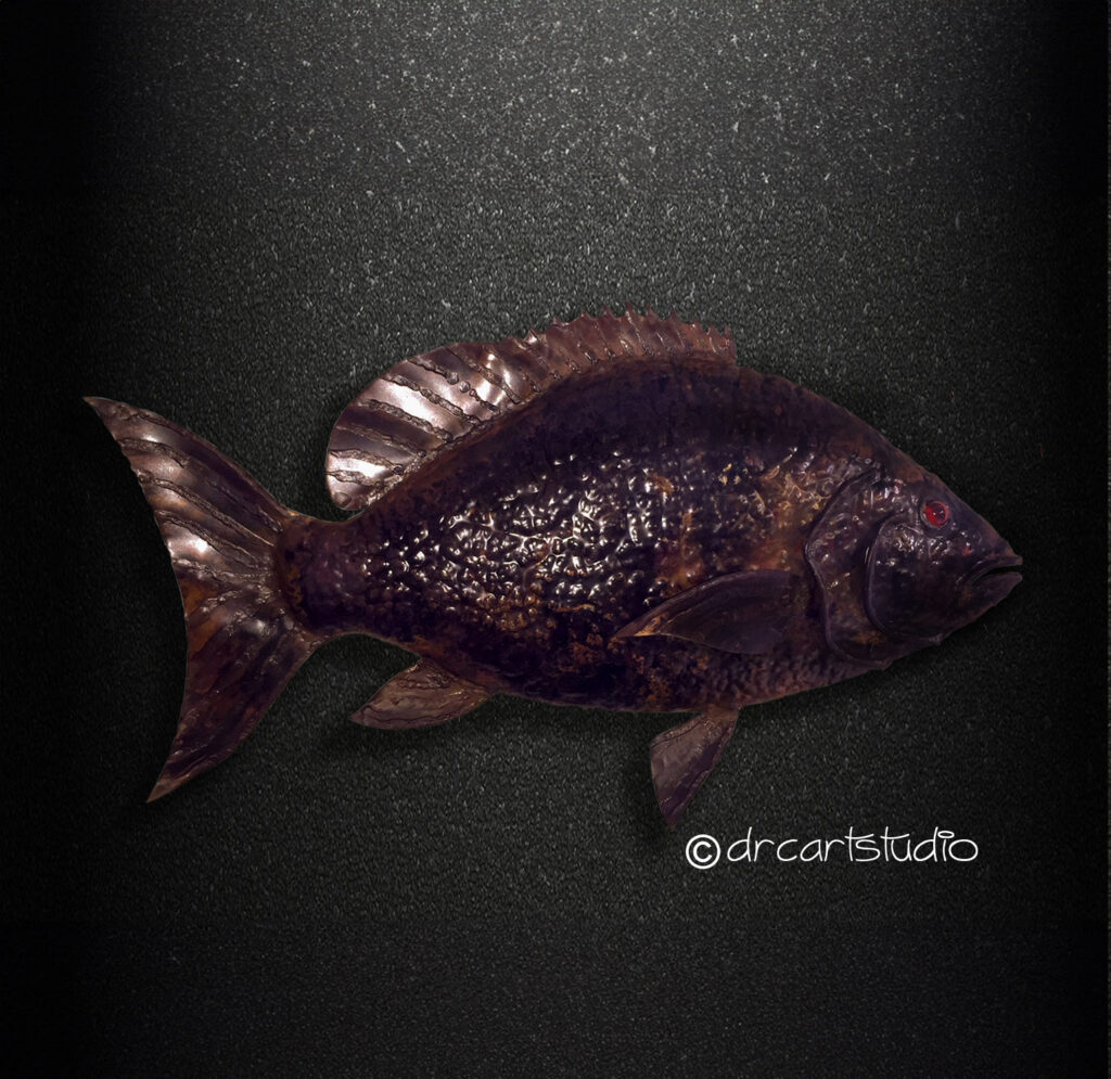 Photo of a hand made copper fish, a red snapper