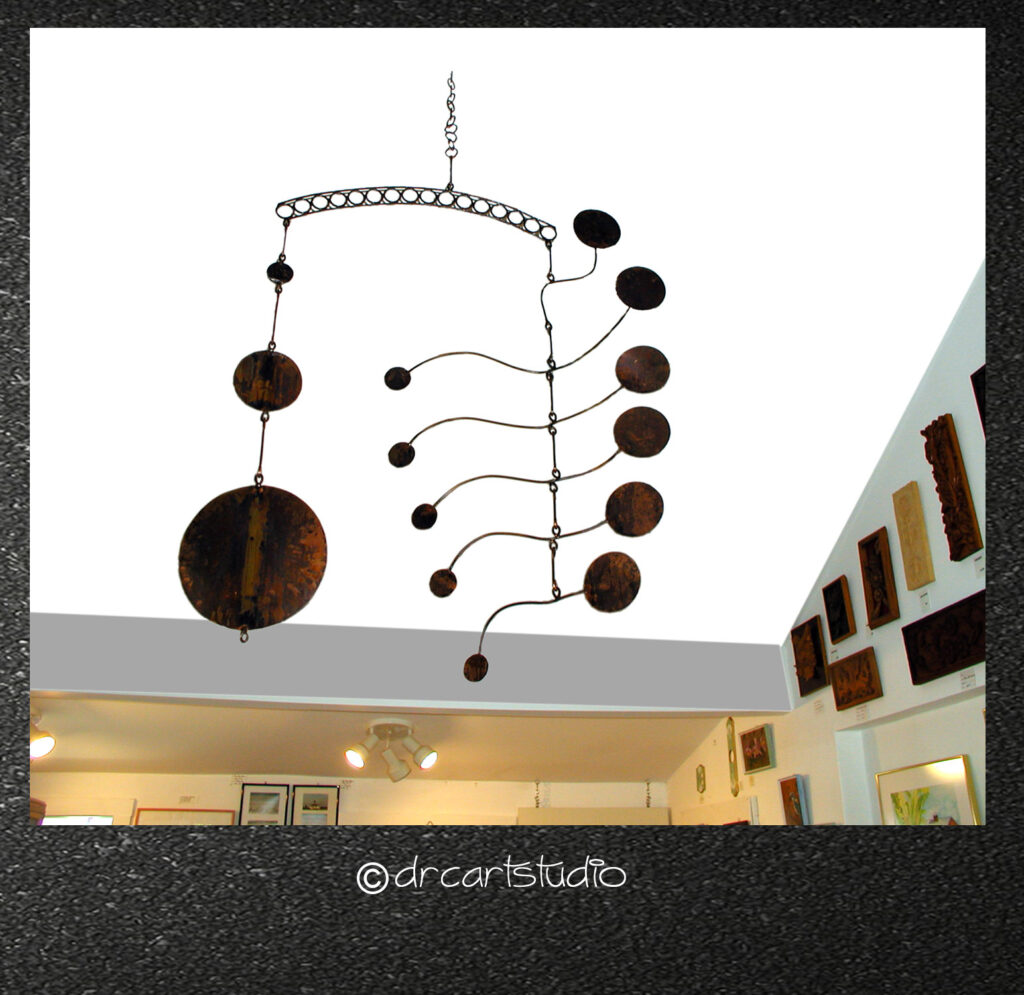 A photo of a handmade copper mobile