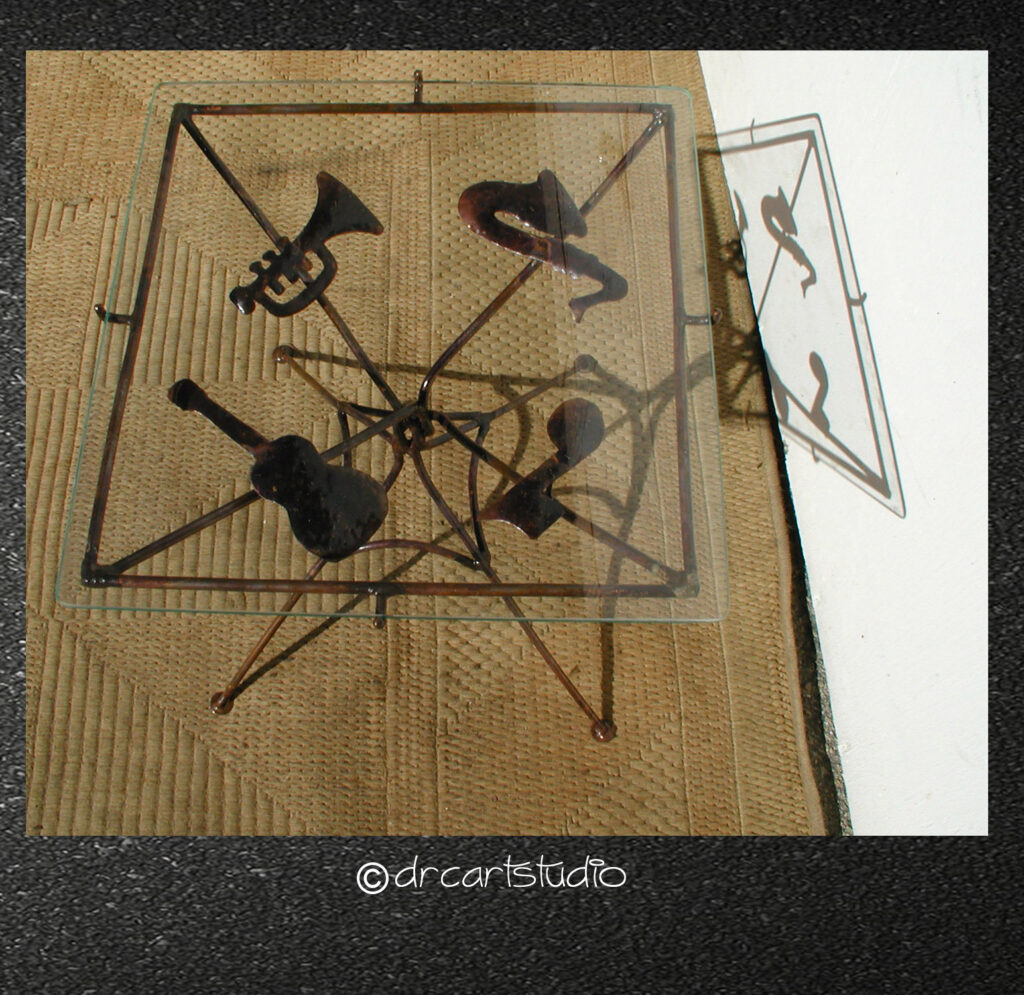 A photo of a handmade copper music table