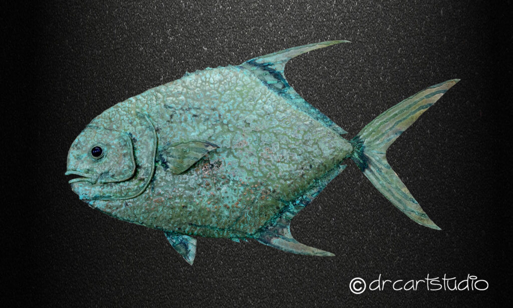A photo of a hand made copper fish, a Permit