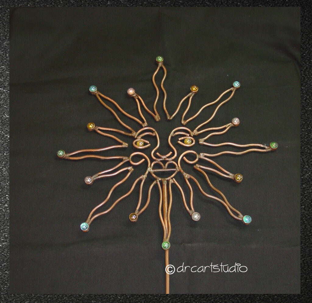 A photo of a handmade copper sun