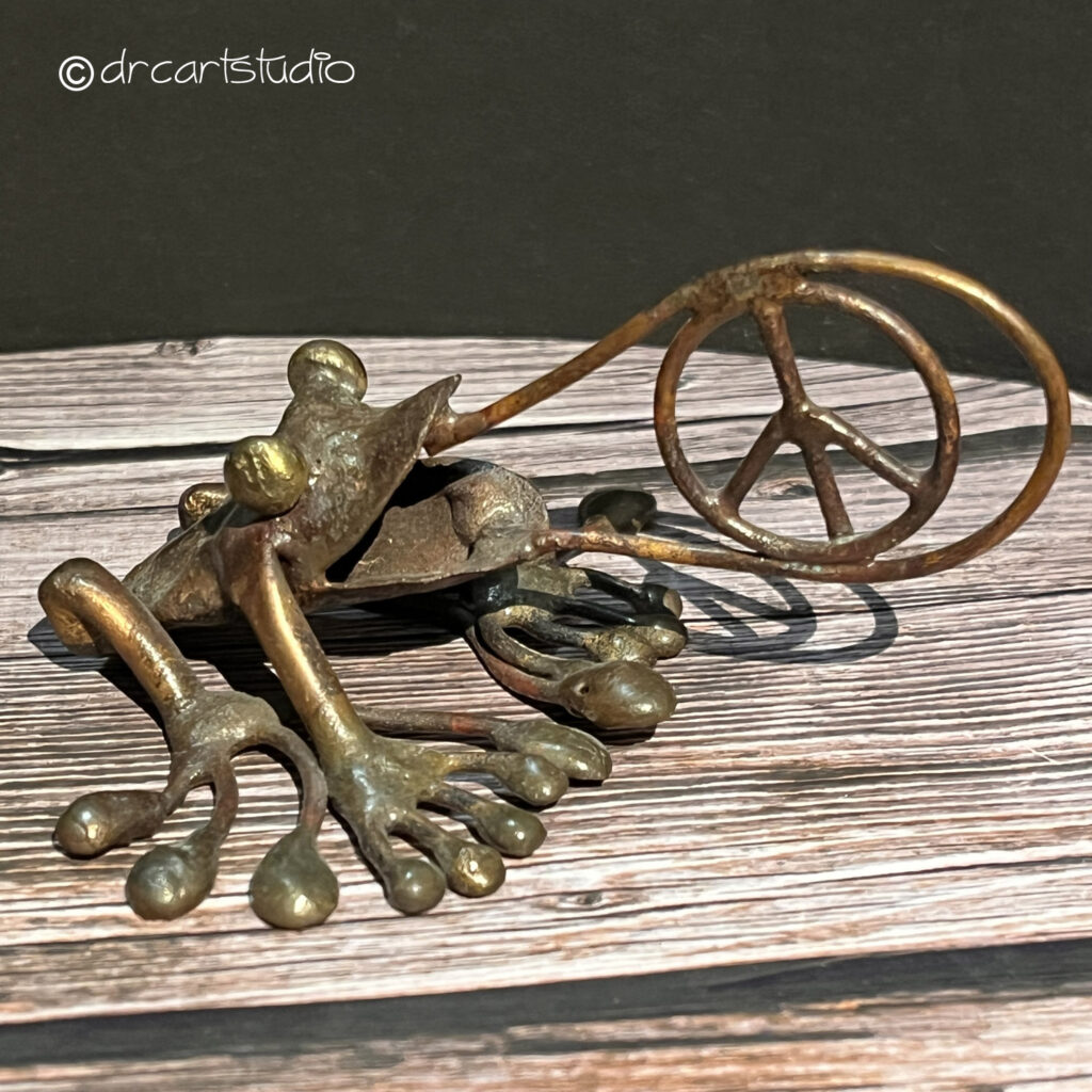 Photo of a hand-made copper frog...peace