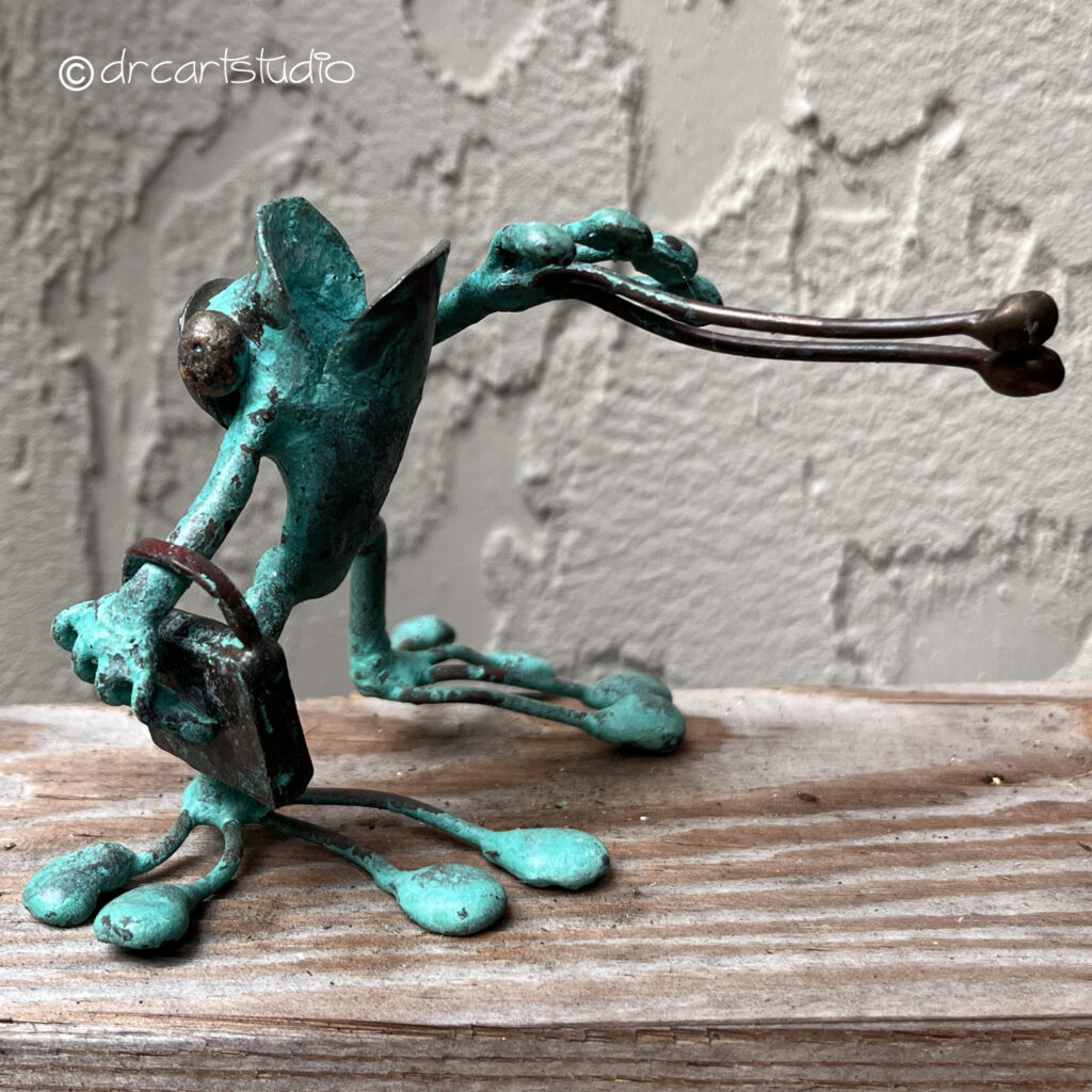 Photo of a hand-made copper frog...the shopper